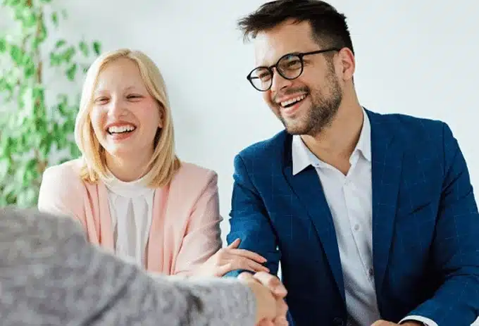 ma and woman shaking hands with lawyer