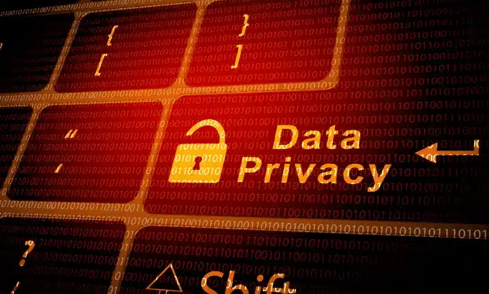 Keyboard with binary code in the background and the words Data Privacy