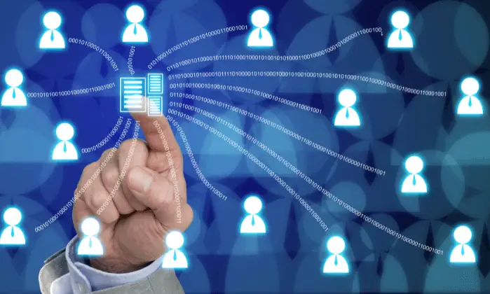 person touching screen with data on it