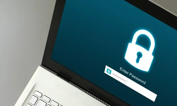 laptop open to log in screen