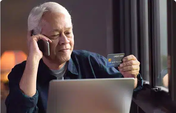 Senior man with credit card