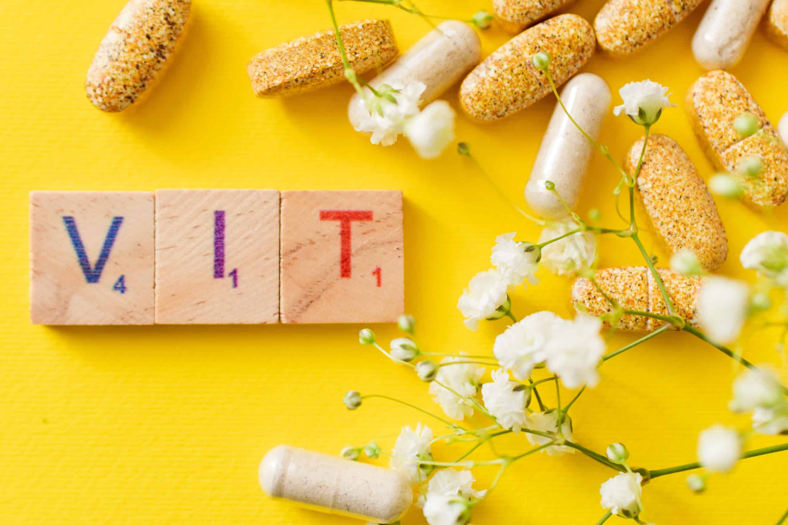 vitamin-still-life-with-flowers-on-yellow-backdrop-2026-03-17-04-26-22-utc