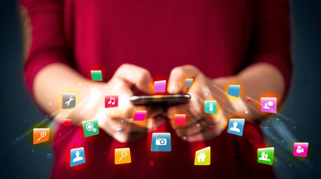 person using smartphone with application icons