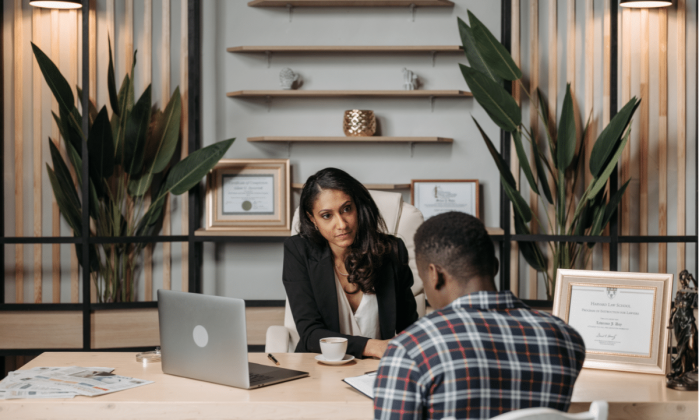 female attorney looking at her client