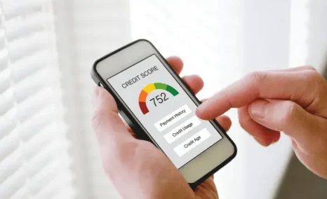 man looking at credit score on cell phone